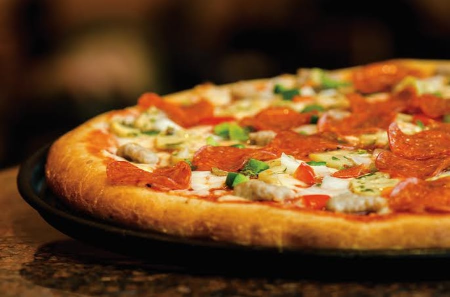 18 tommu pizza mánaðarins og 2 ltr. gos
